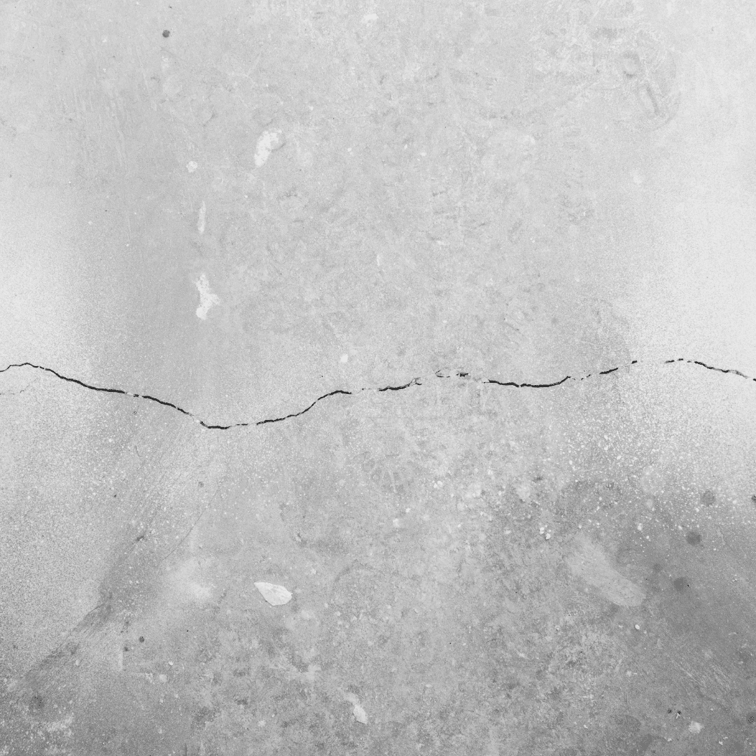 Cracks in foundation | A hairline crack on a cement wall.