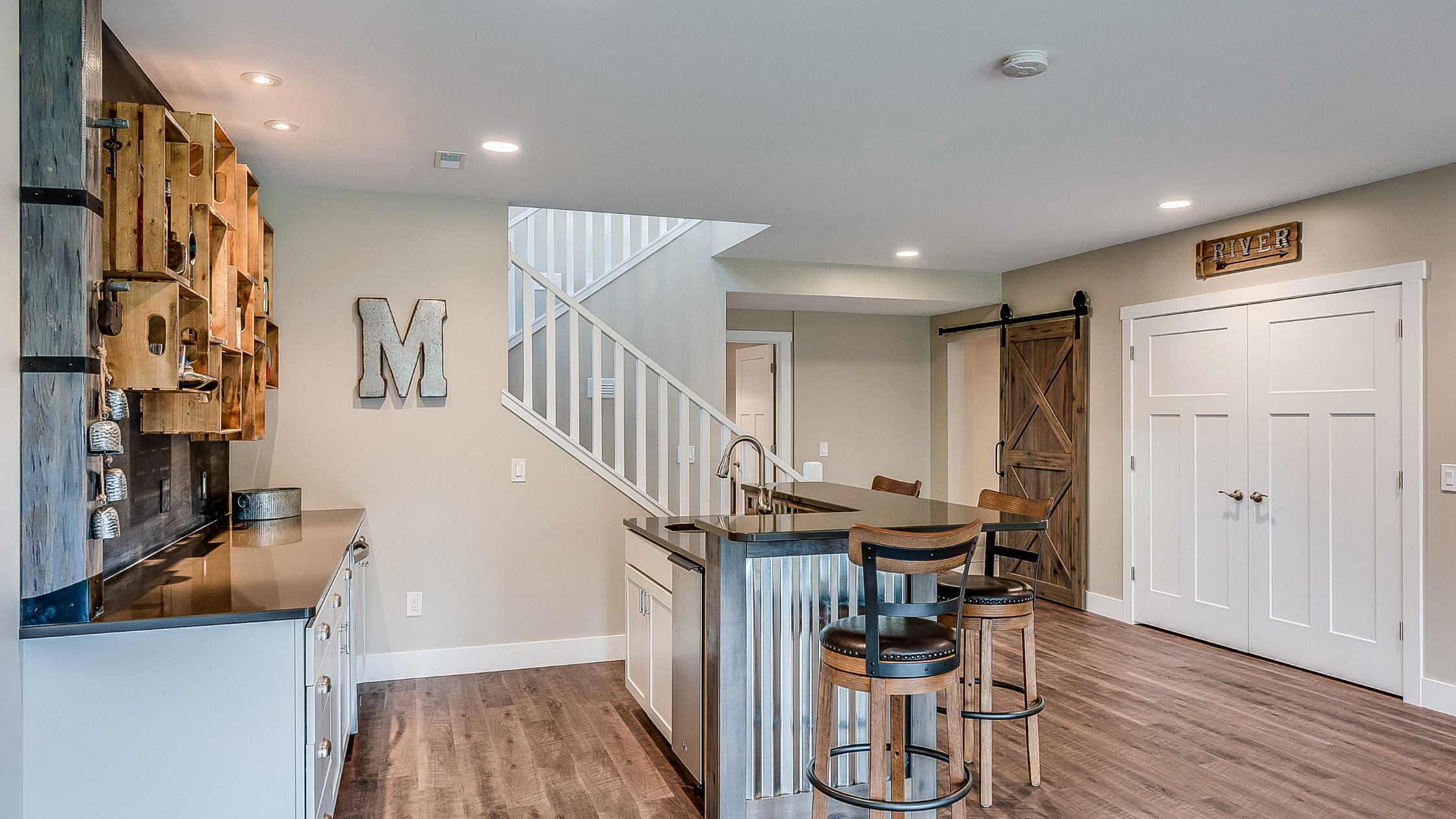 Retrofitting Your Basement | Retrofitted Basement with a bar top and kitchen corner.
